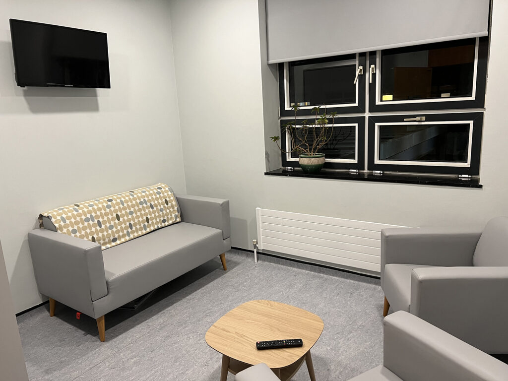 Family Room refurbishment sofa, armchair, table, tv and window